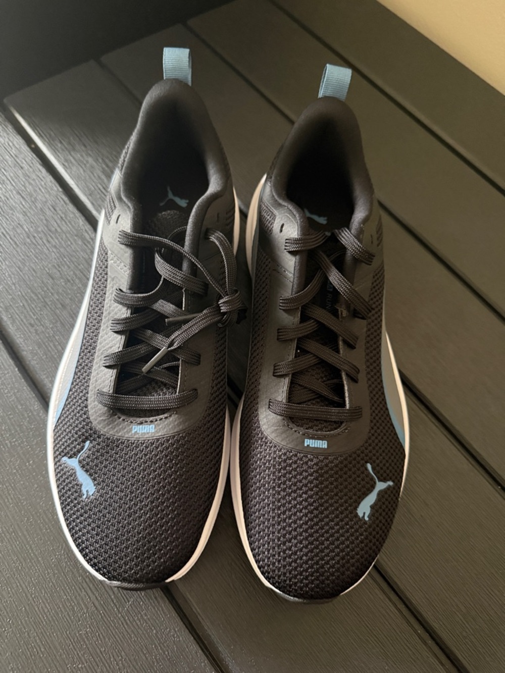 Puma Black Sneakers with Light Blue Logo Accents